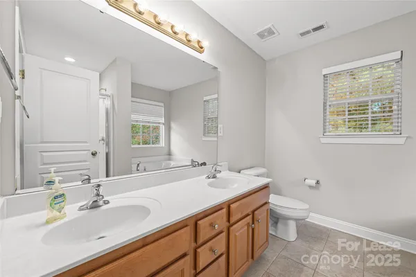 a white bath tub sitting next to a window