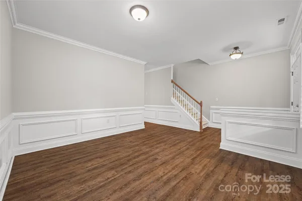a view of entryway with wooden floor