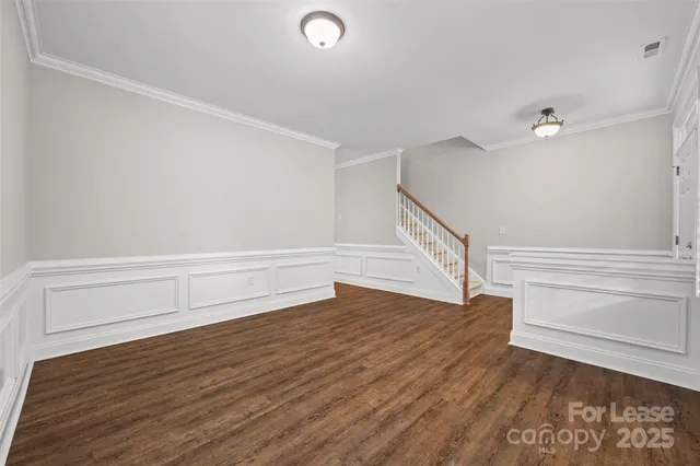 a view of entryway with wooden floor