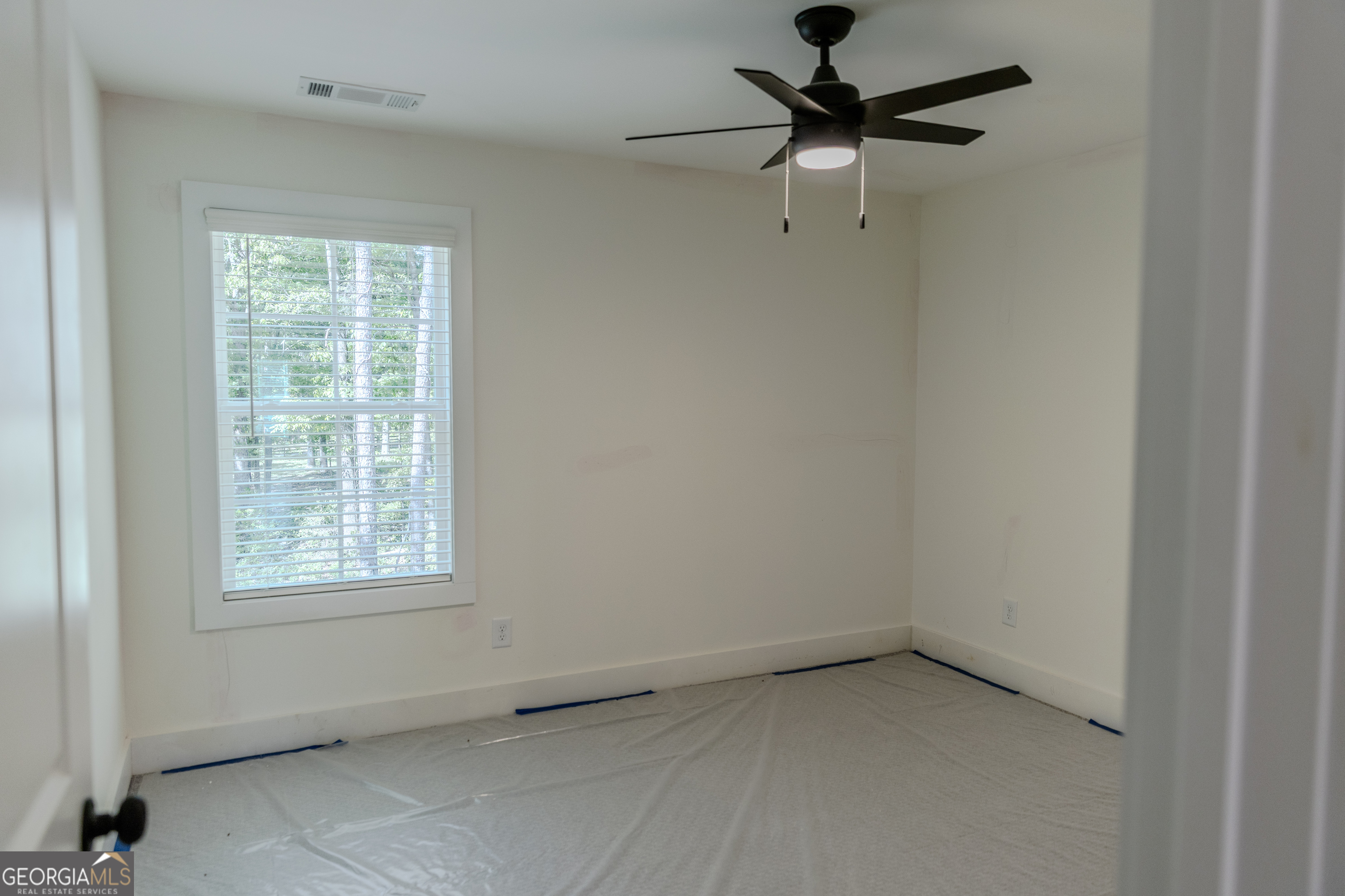 632 Campbell Road Covington, GA 30014 - Photo 41 of 60 a view of a window in an empty room