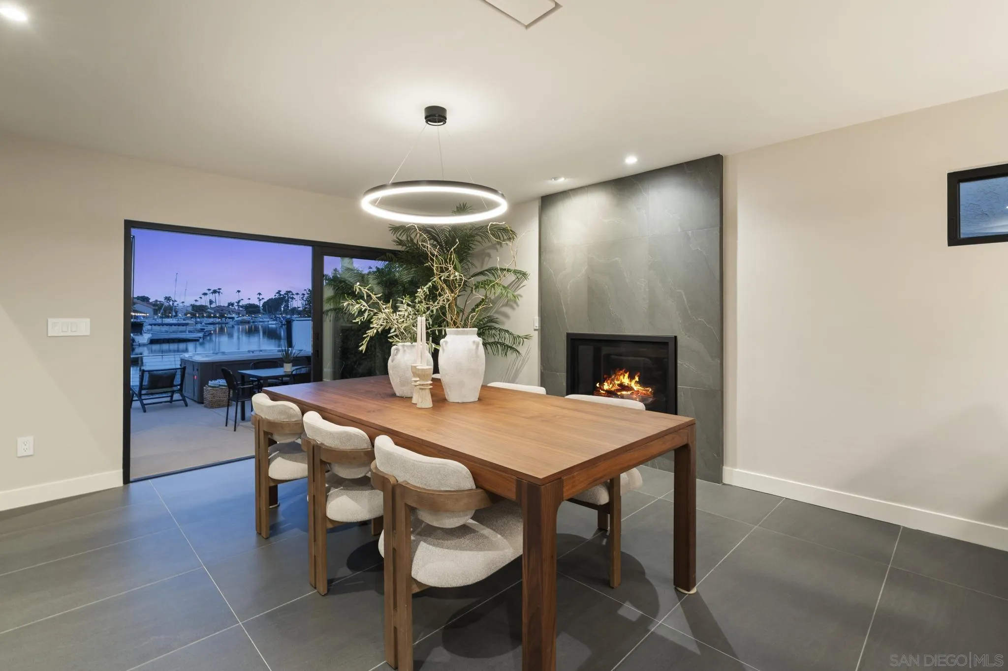 41 Blue Anchor Cay Road Coronado, CA 92118 - Photo 20 of 74 a view of a dining room with furniture and wooden floor