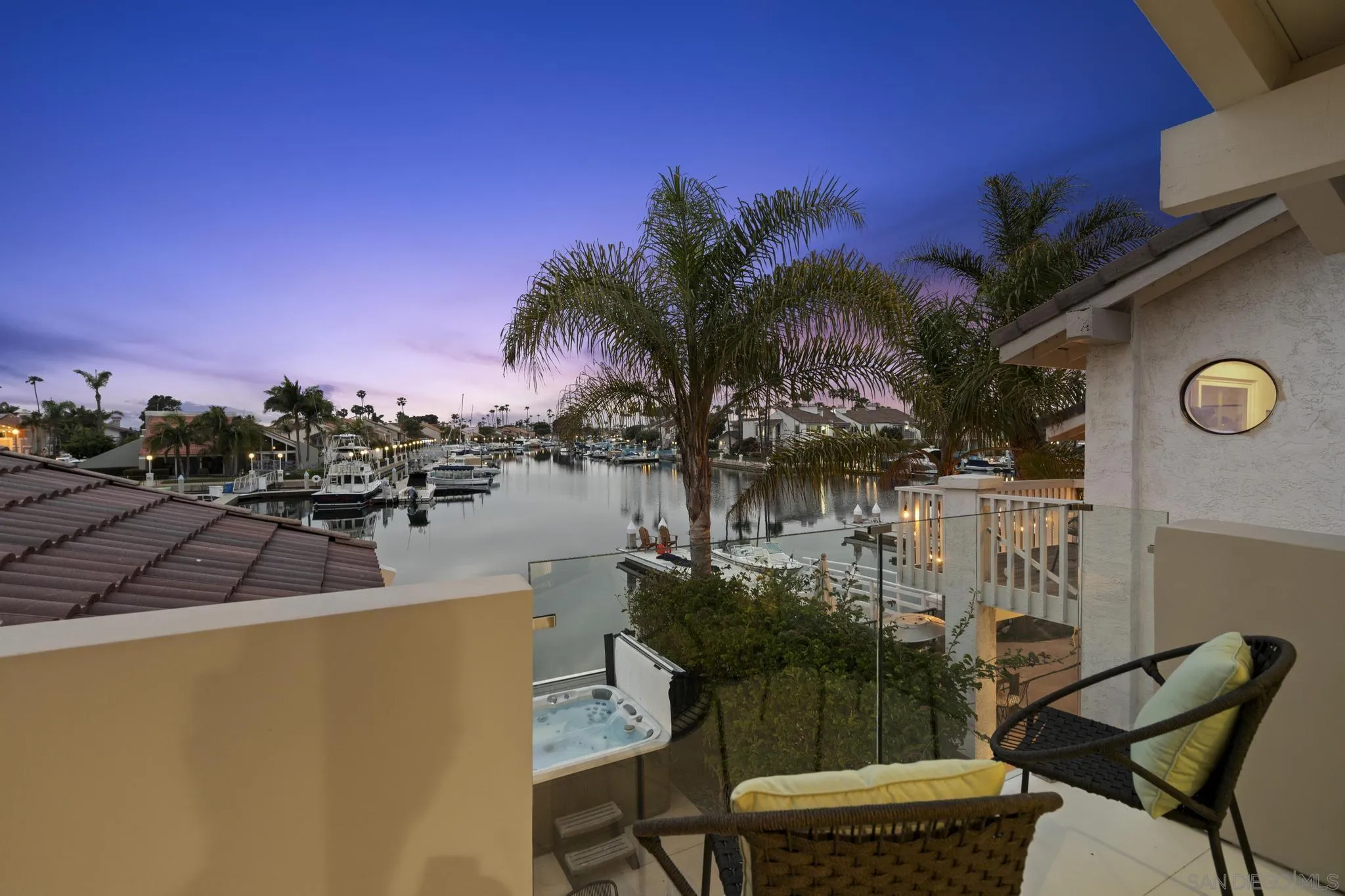 41 Blue Anchor Cay Road Coronado, CA 92118 - Photo 50 of 74 a view of a lake with couches and city view
