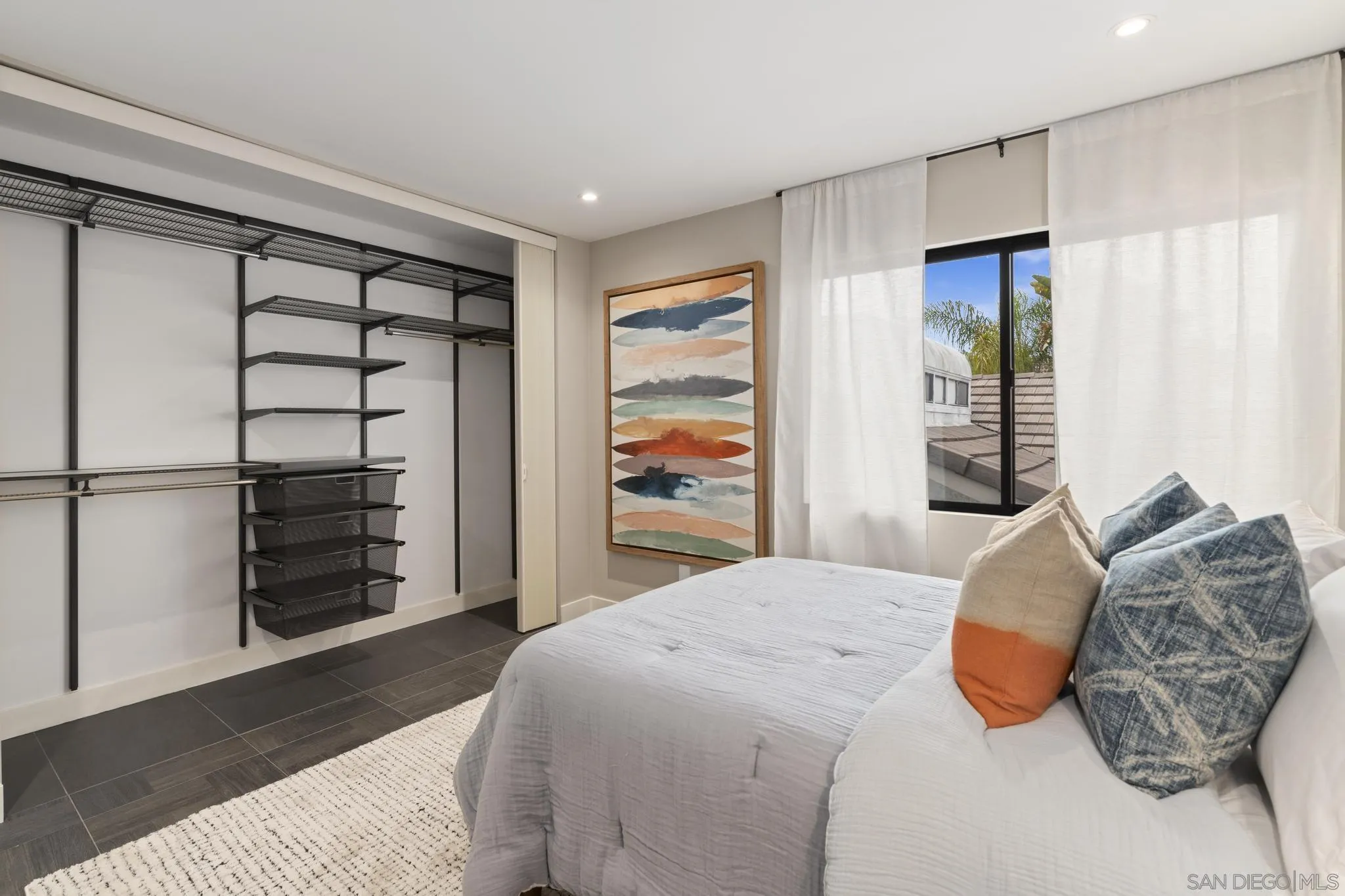 41 Blue Anchor Cay Road Coronado, CA 92118 - Photo 68 of 74 a bedroom with a bed and walk in closet