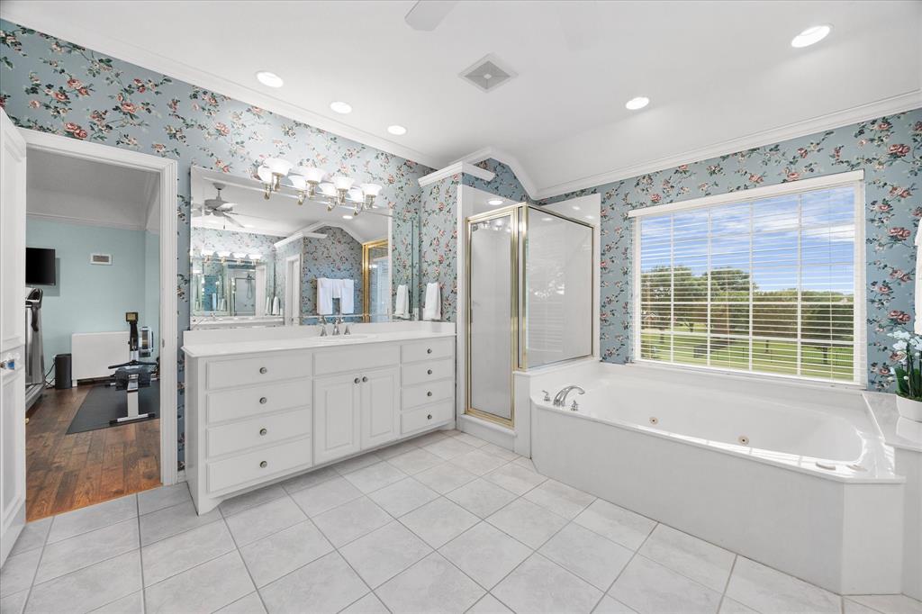 506 Meadowview Road Heath, TX 75032 - Photo 20 of 32 a spacious bathroom with a large tub shower and double vanity