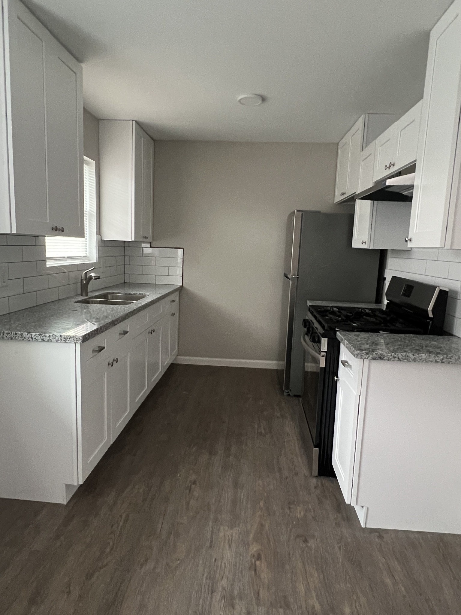 9745 Long Point Road, Unit 37 Houston, TX 77055 - Photo 13 of 17 Kitchen overview with clean layout, ample cabinet space, and updated finishes.