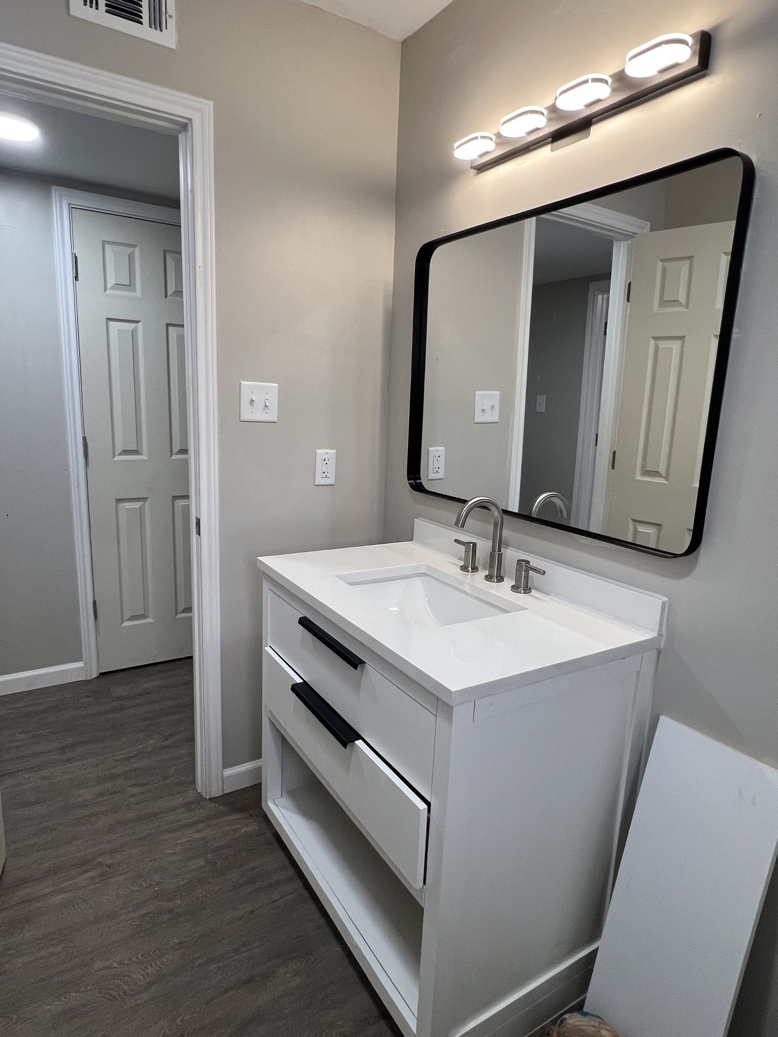 9745 Long Point Road, Unit 37 Houston, TX 77055 - Photo 5 of 17 Updated bathroom vanity with sleek countertop, modern faucet, and contemporary framed mirror.