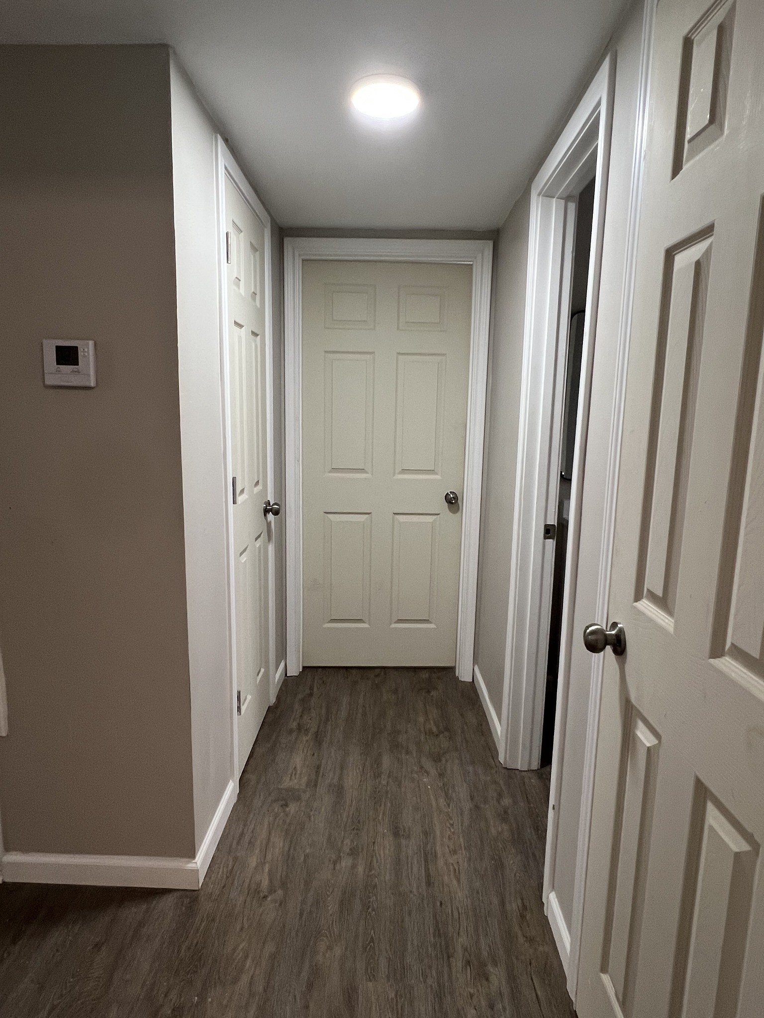 9745 Long Point Road, Unit 37 Houston, TX 77055 - Photo 10 of 17 Interior hallway view showing clean lines, multiple storage/room access points, and updated flooring.