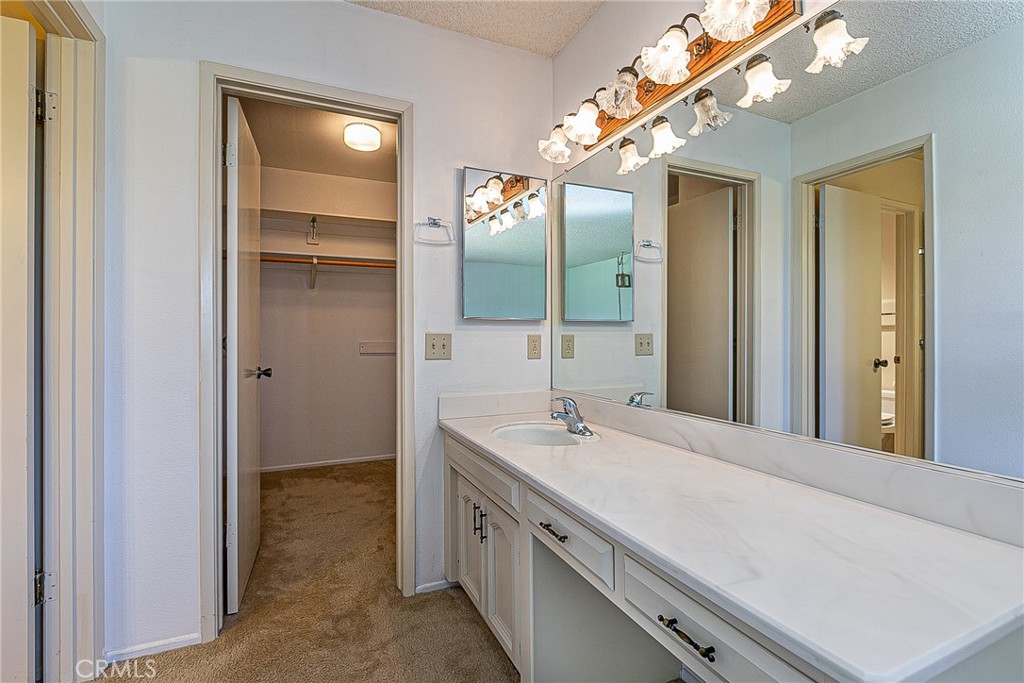 66 Stanford Circle Lompoc, CA 93436 - Photo 14 of 29 a bathroom with a double vanity sink and a mirror