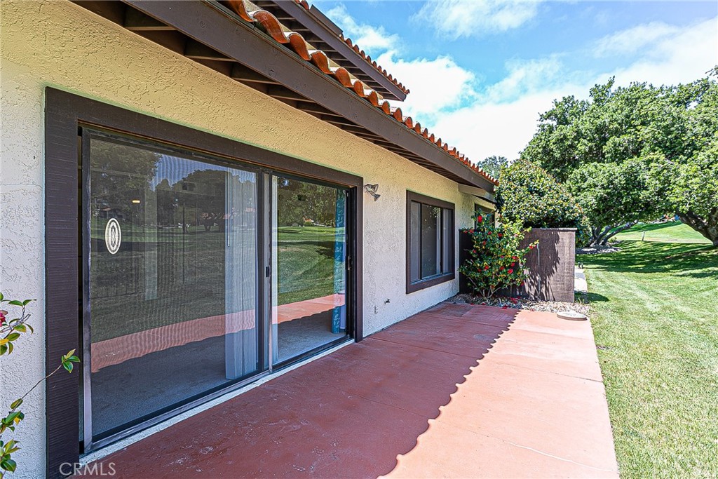 66 Stanford Circle Lompoc, CA 93436 - Photo 22 of 29 a porch with a table and chairs