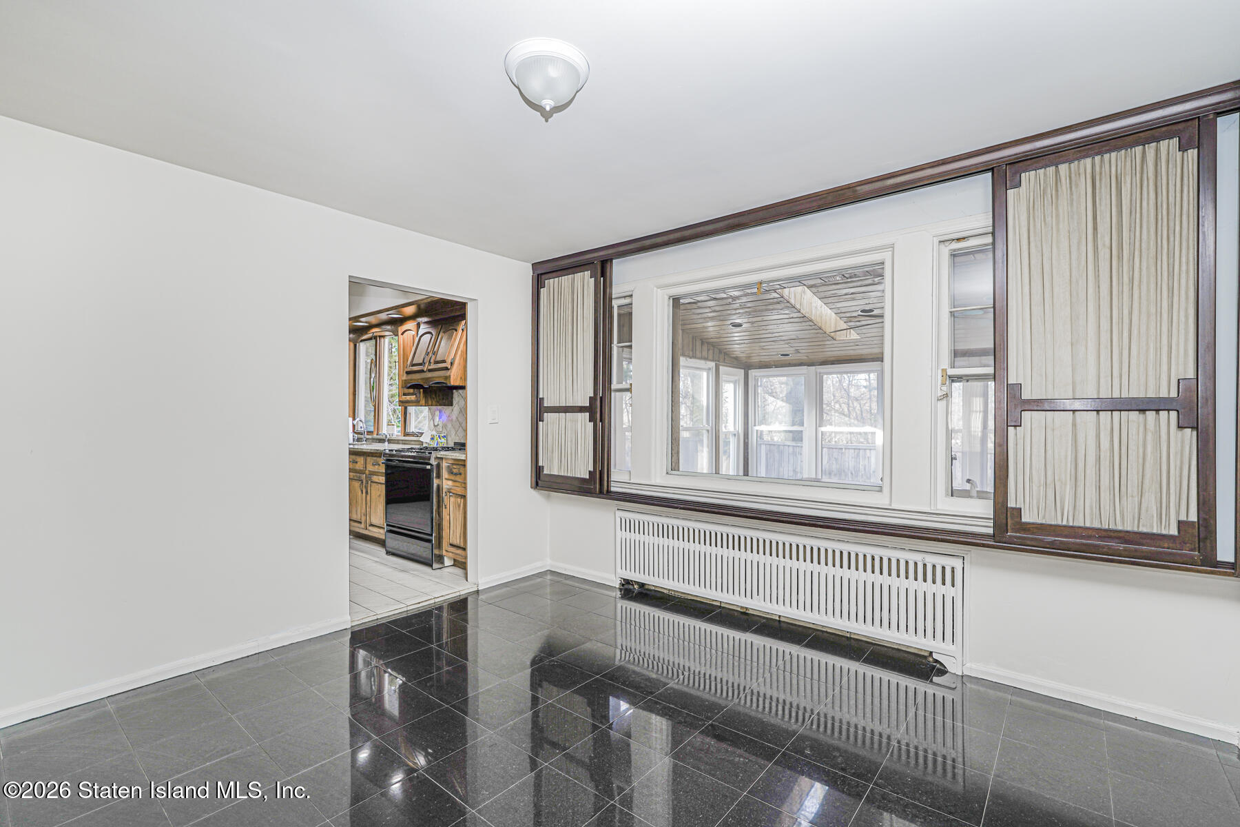 35 Rice Avenue Staten Island, NY 10301 - Photo 11 of 33 a view of a bedroom with wooden floor
