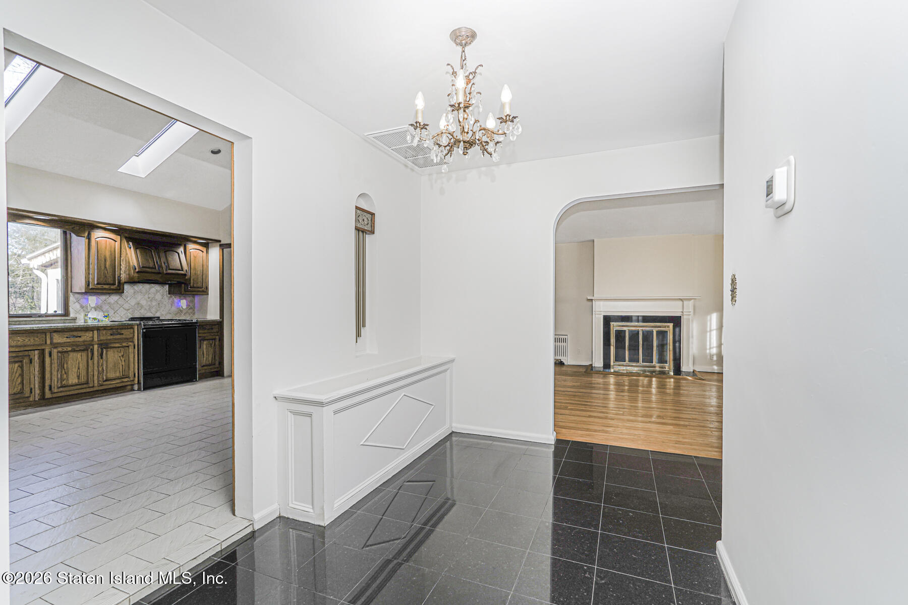 35 Rice Avenue Staten Island, NY 10301 - Photo 12 of 33 a view of a hallway with chandelier and fire place