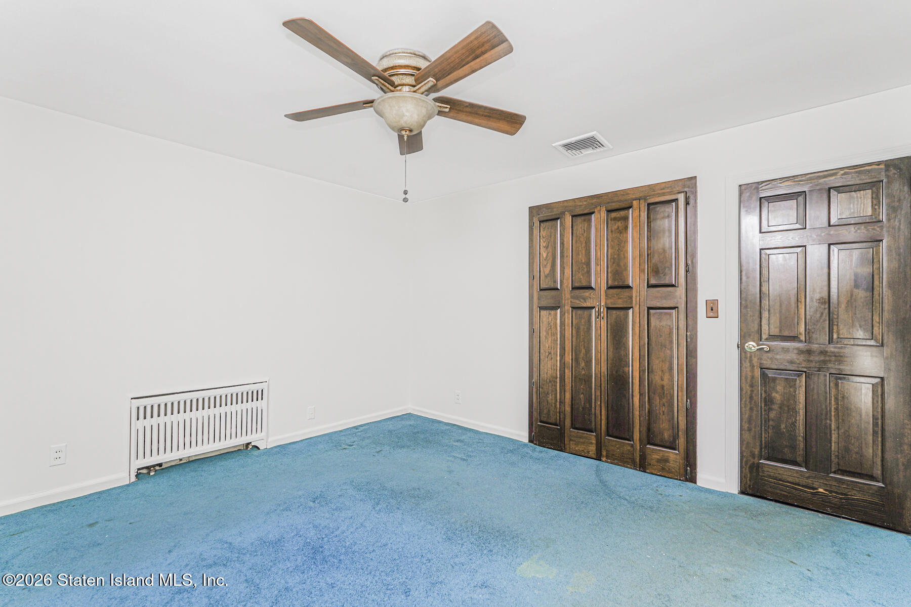 35 Rice Avenue Staten Island, NY 10301 - Photo 17 of 33 an empty room with closet and a ceiling fan