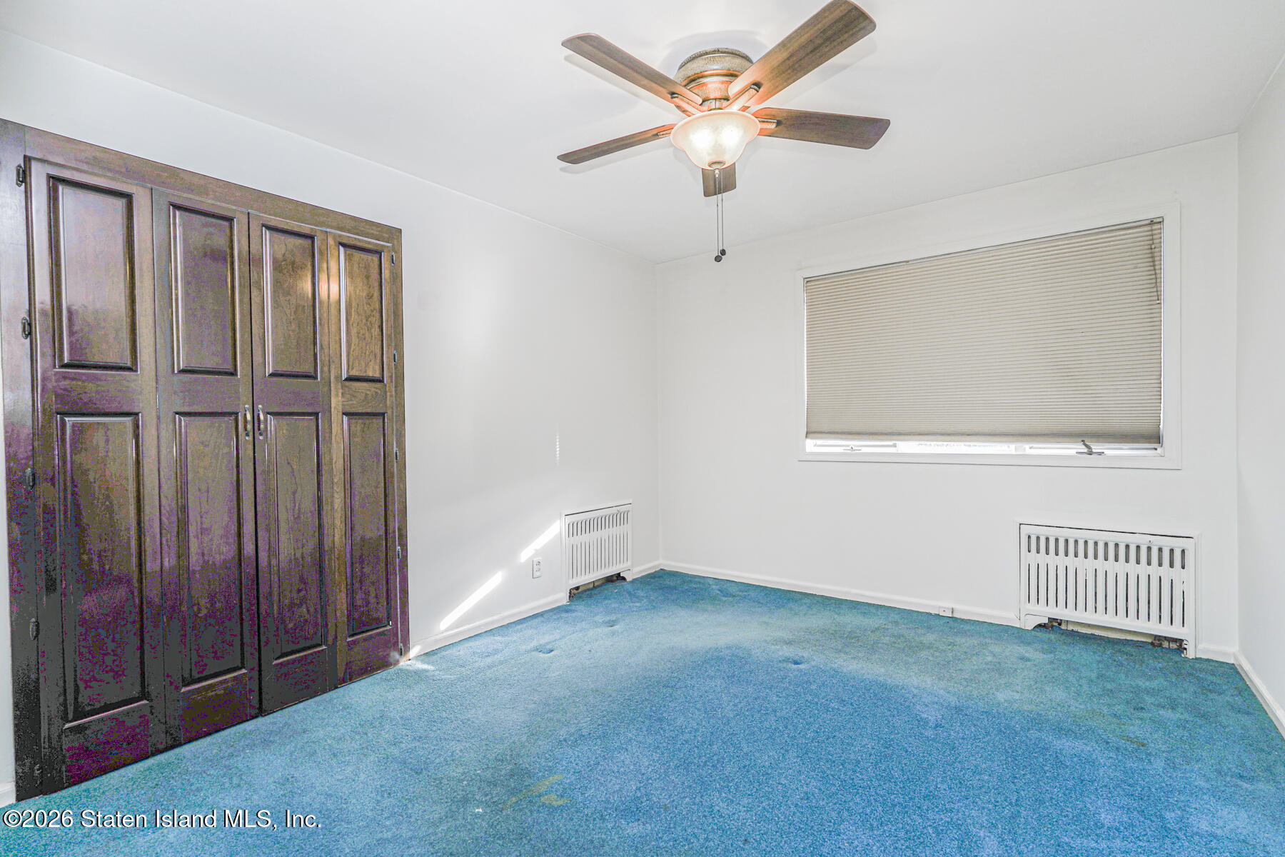 35 Rice Avenue Staten Island, NY 10301 - Photo 18 of 33 wooden floor in an empty room with a window