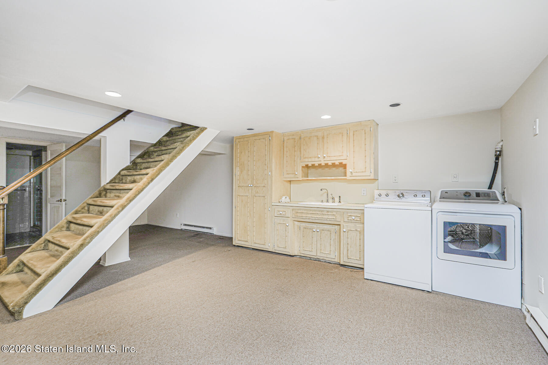 35 Rice Avenue Staten Island, NY 10301 - Photo 21 of 33 a view of storage and utility room with washer and dryer