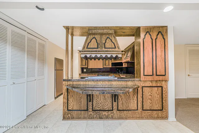 a view of a kitchen with a stove top oven