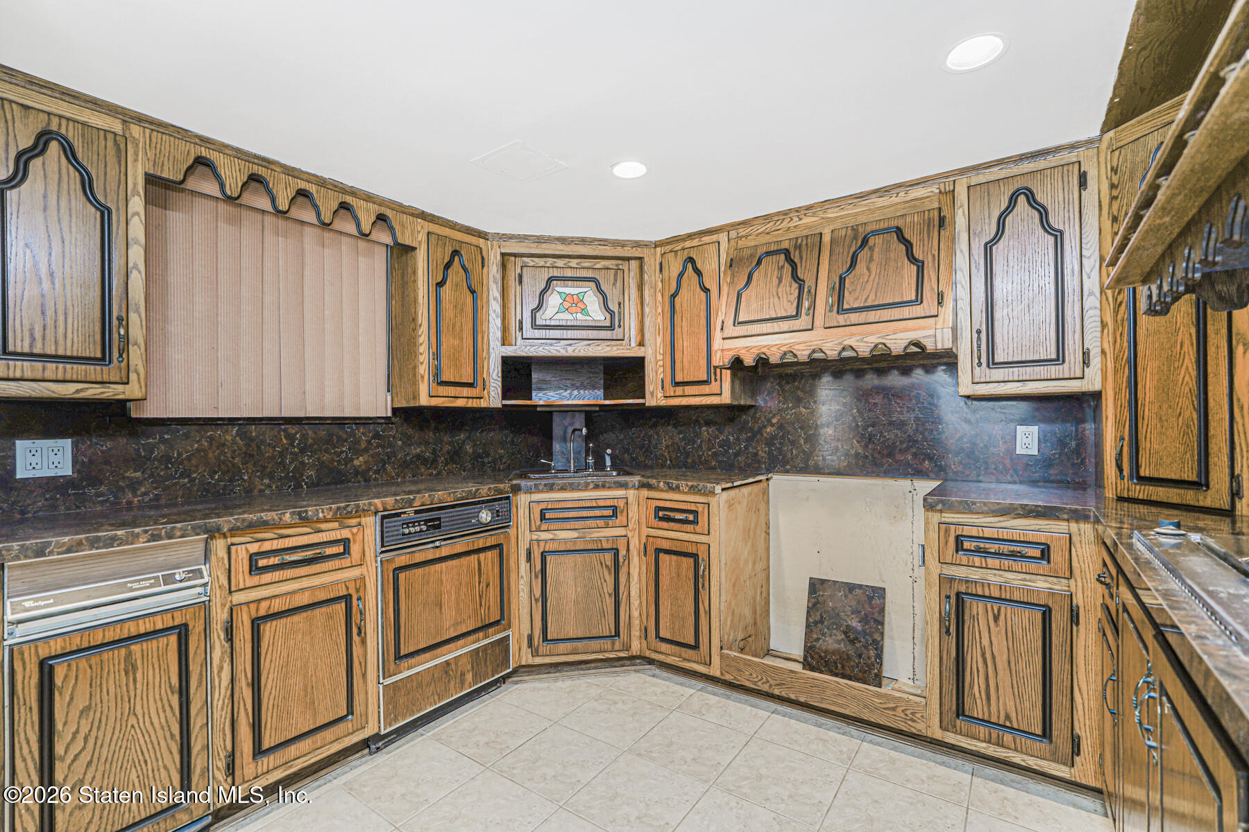 35 Rice Avenue Staten Island, NY 10301 - Photo 25 of 33 a kitchen with stainless steel appliances granite countertop a stove and a sink