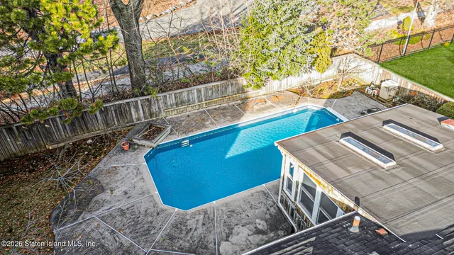 a view of a balcony with two chairs