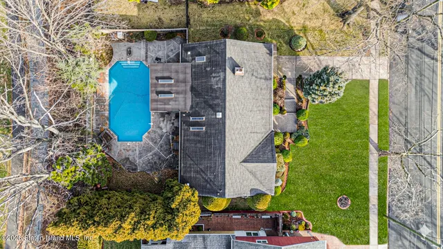aerial view of a house with a garden