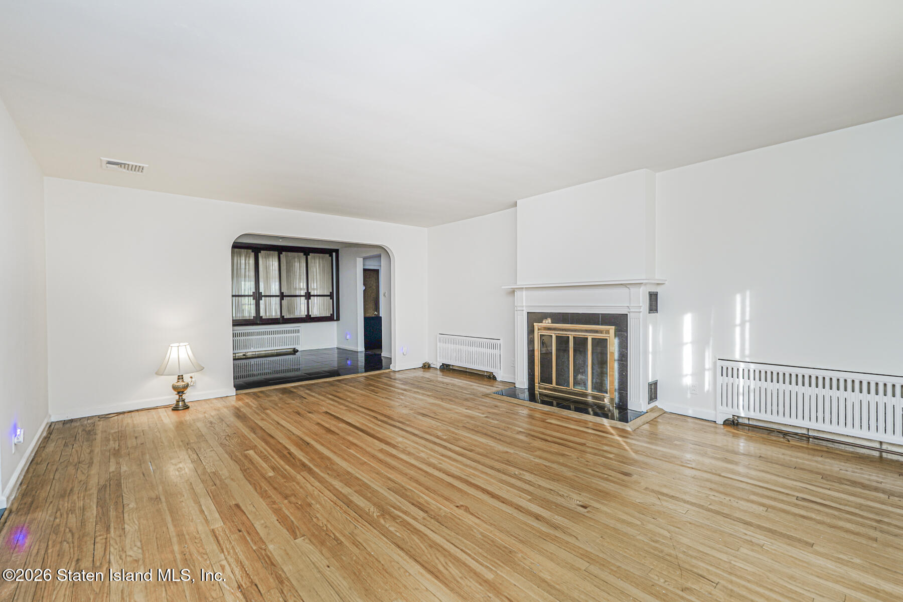 35 Rice Avenue Staten Island, NY 10301 - Photo 6 of 33 a bedroom with a bed and a view of kitchen