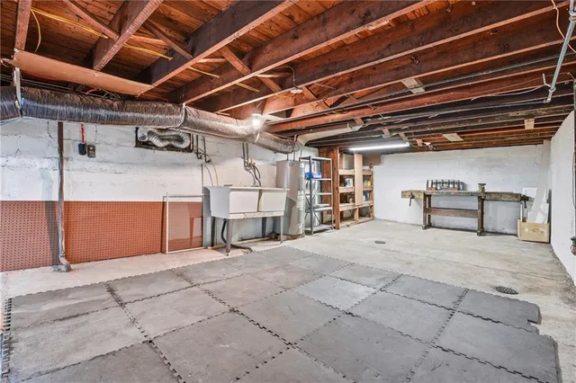a view of empty room with wooden ceiling