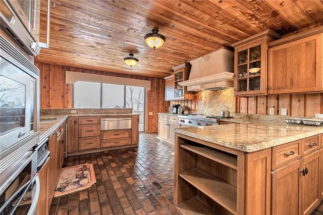 a kitchen with a stove and a microwave oven