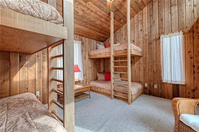 a view of a balcony with chair and wooden floor
