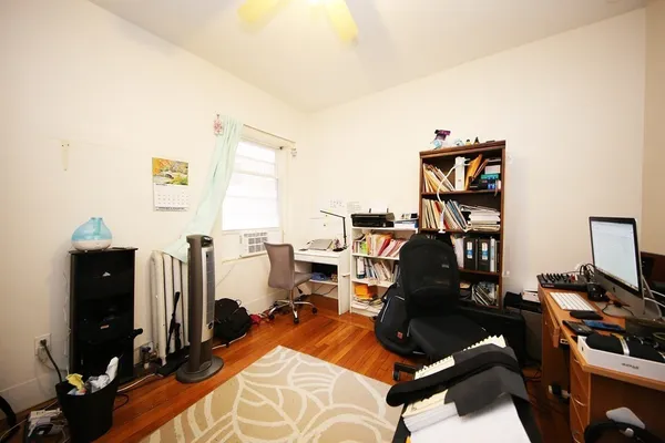 a view of a workspace with furniture and bedroom