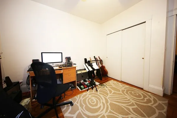 a view of workspace with wooden floor