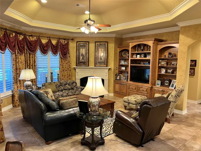 a living room with furniture fireplace and lamp