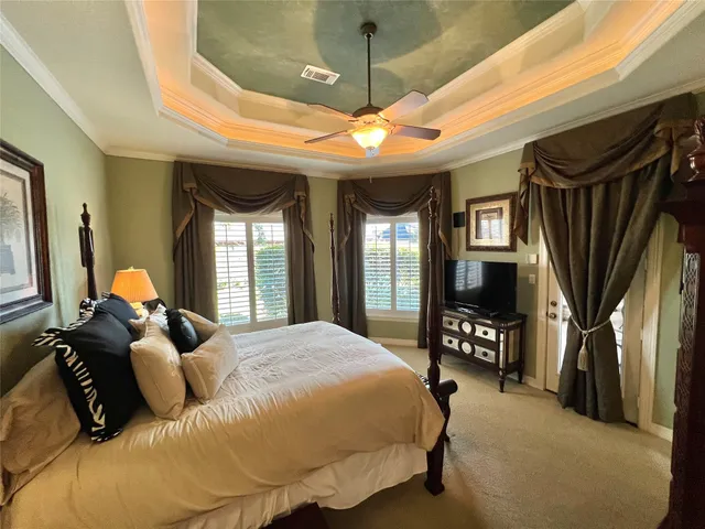 a bed room with a bed and a tv