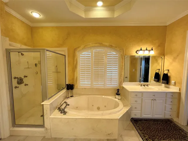 a bathroom with a bathtub and a sink