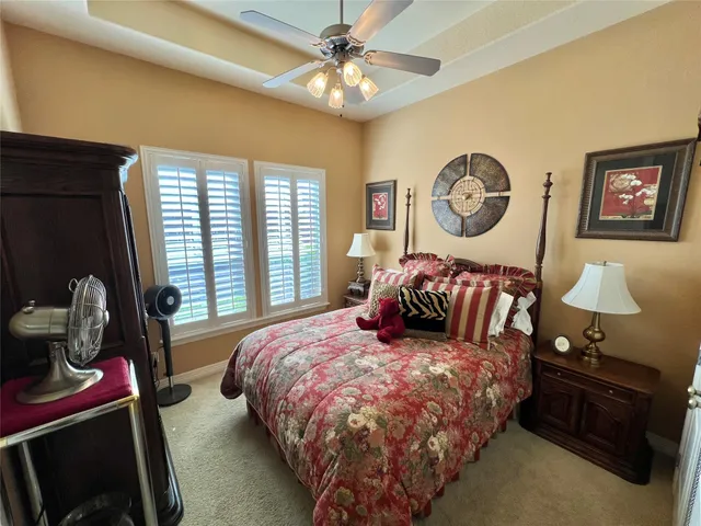 a bed room with a bed and a lamp