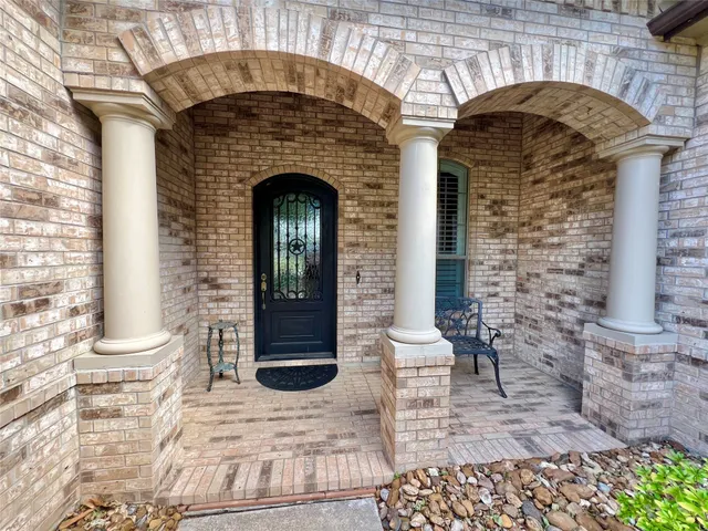 a front view of a house with outdoor seating