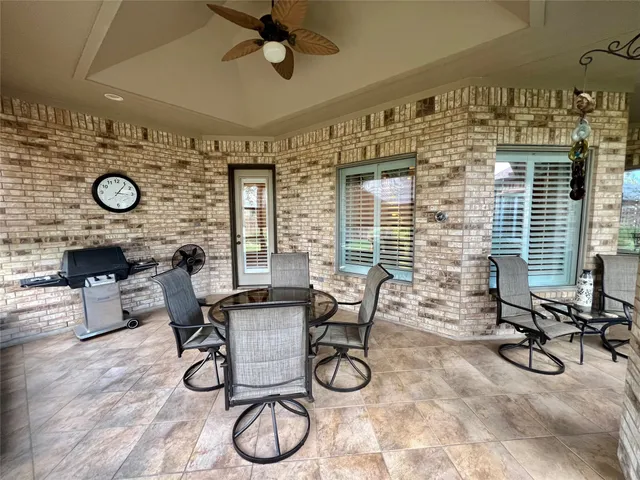a view of a livingroom with furniture and a window