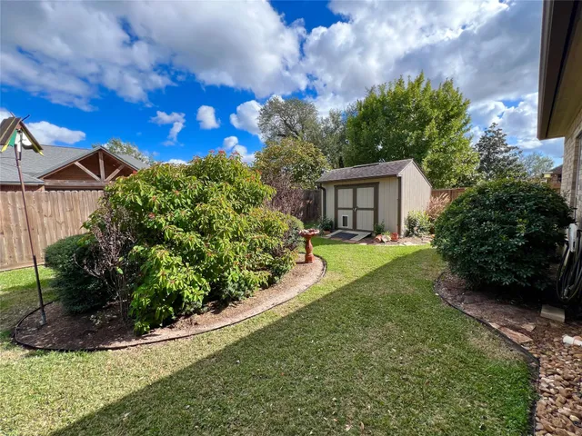 a view of house with garden