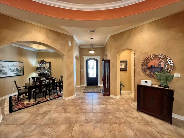 a view of a hallway with livingroom