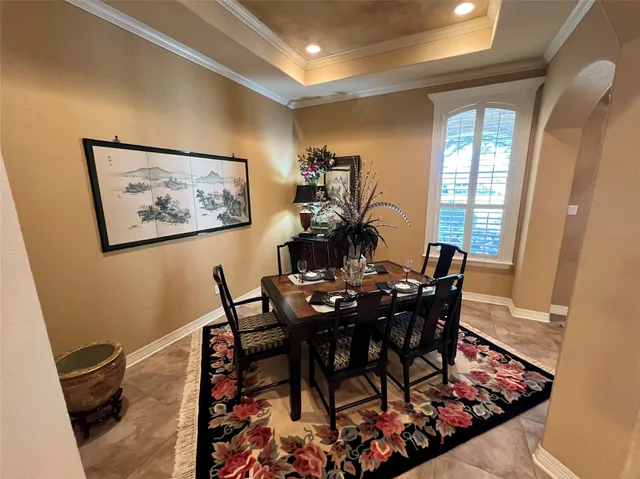 a view of a dining room with furniture and window