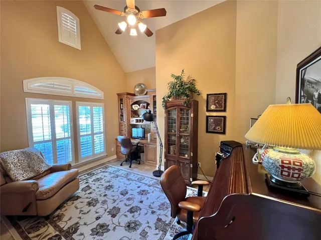 a bedroom with furniture and a window