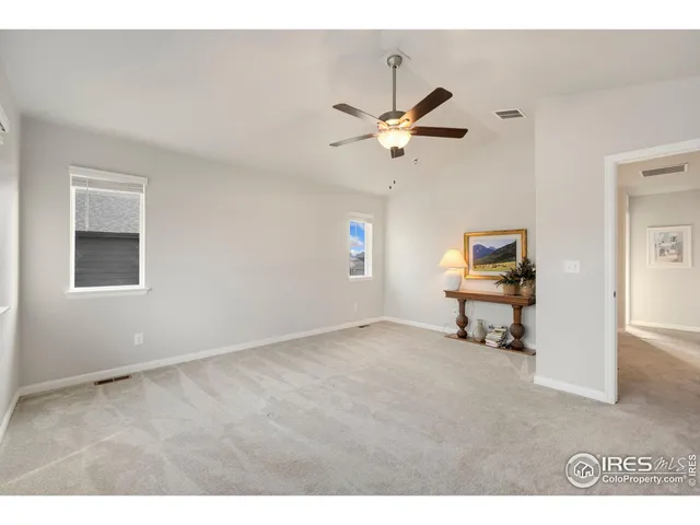 a view of work room with window and ceiling fan