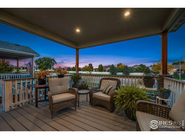 a view of a couches and dinning table and chairs in patio