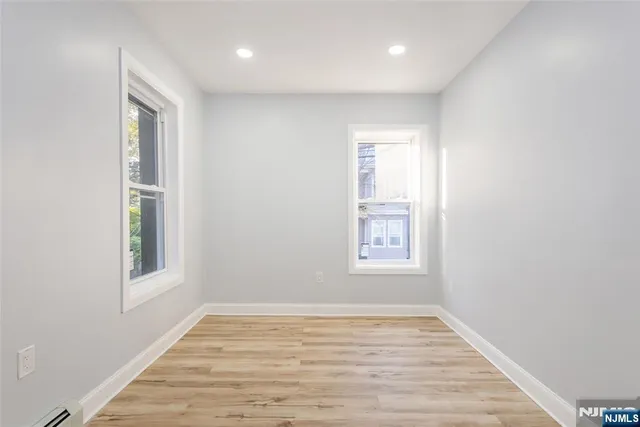 a view of an empty room and window