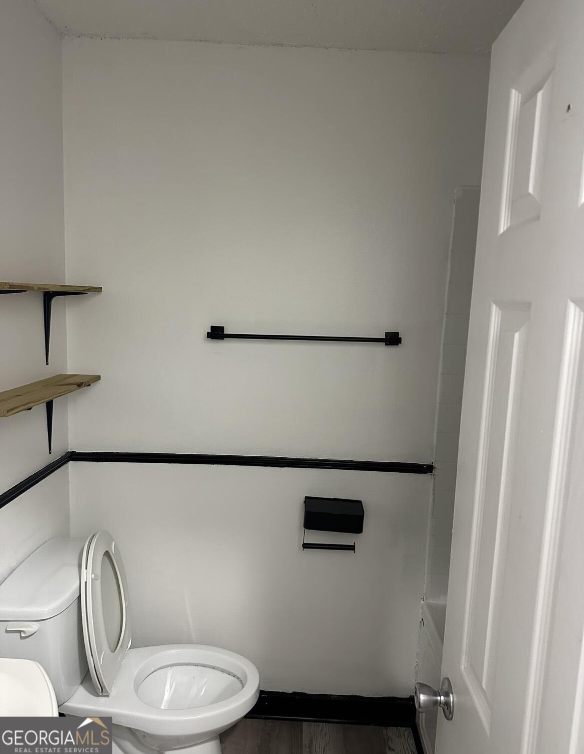 2725 Flintlock Place Austell, GA 30106 - Photo 16 of 28 a bathroom with a toilet and a sink