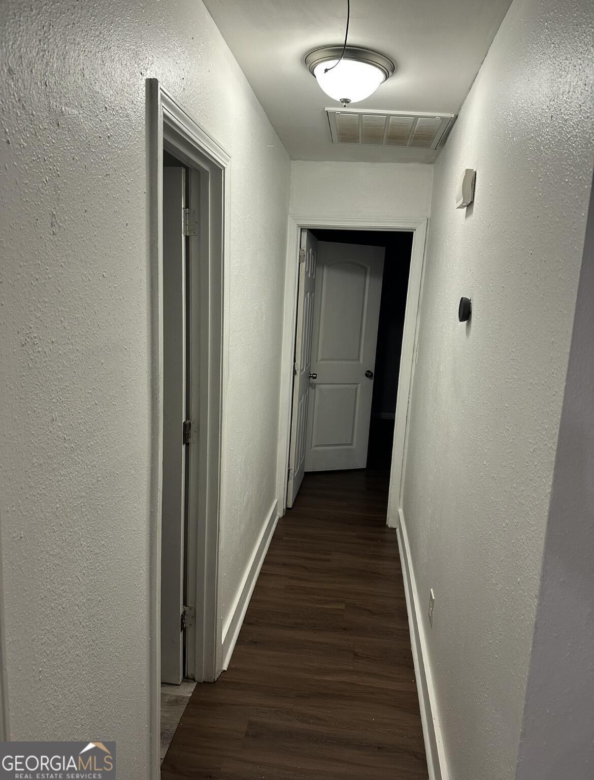 2725 Flintlock Place Austell, GA 30106 - Photo 19 of 28 a view of a hallway with wooden floor