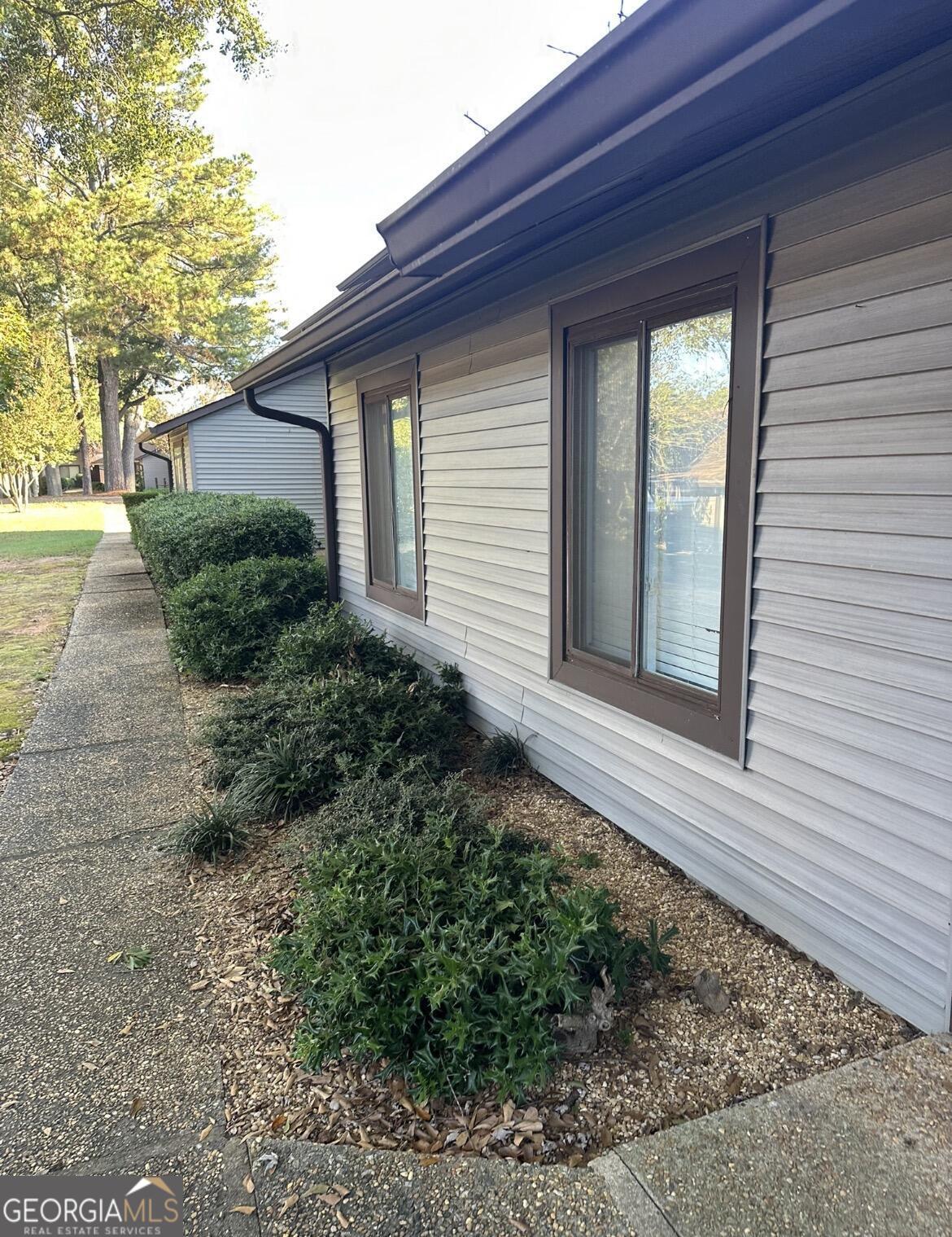 2725 Flintlock Place Austell, GA 30106 - Photo 2 of 28 a front view of a house with garden