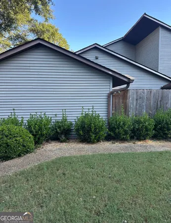 a backyard of a house with lots of green space