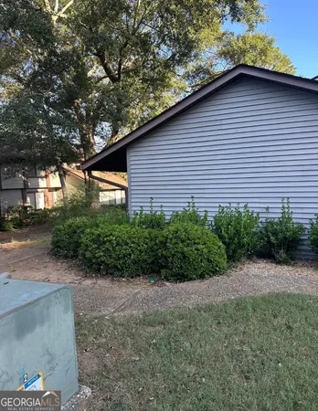 a view of a backyard with a patio