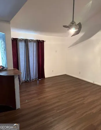 a view of a hardwood floor in a room