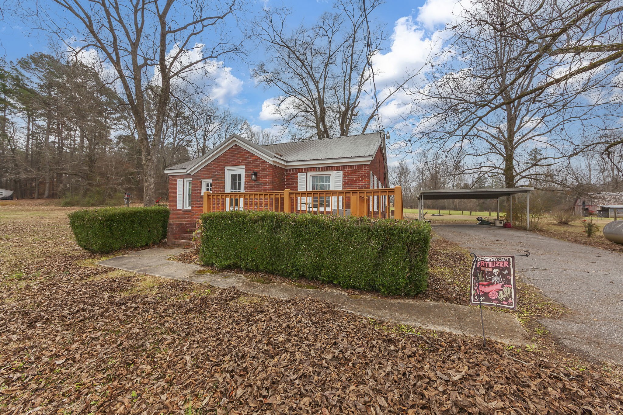 9000 Teague Road Medon, TN 38356 - Photo 2 of 22 a front view of a house with a yard and garage