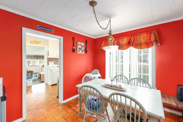 a view of a dining room with furniture window and outside view