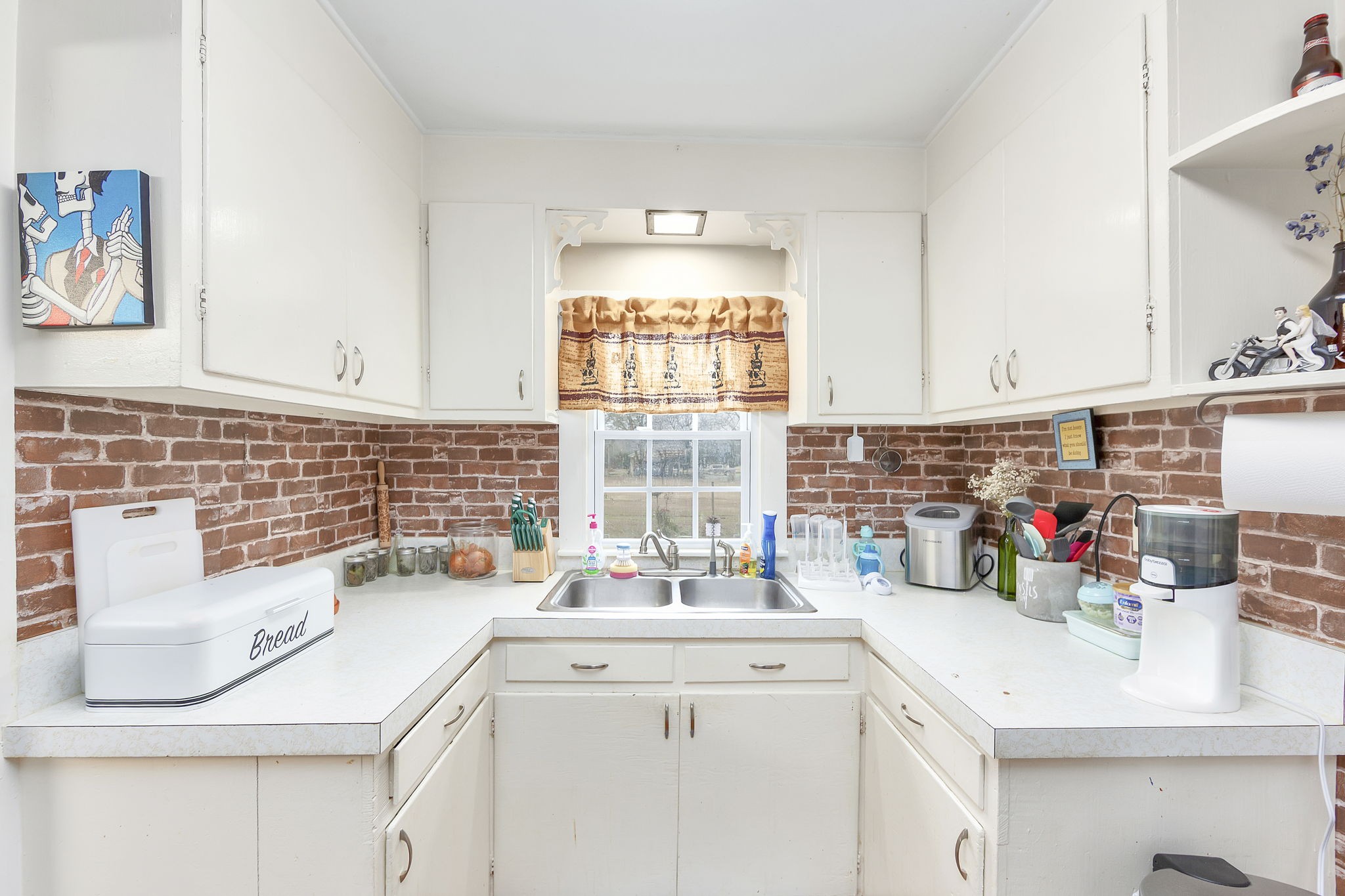 9000 Teague Road Medon, TN 38356 - Photo 8 of 22 a kitchen with a sink cabinets and window
